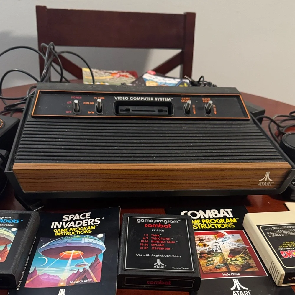 Vintage Authentic Atari 2600 with controllers, games and instruction booklets.